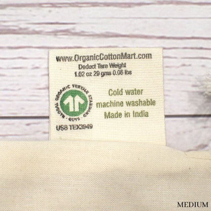 close up of the back side of the medium muslin tag showing tare weight of 1.02 oz.