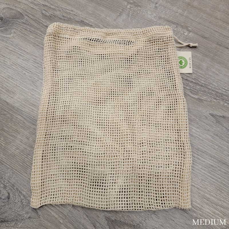 medium mesh produce bag laying flat on wooden surface
