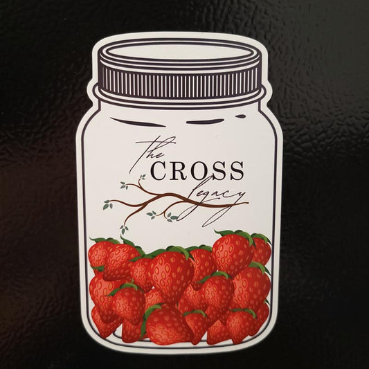 White jar shaped refrigerator magnet with The Cross Legacy logo and strawberries in the bottom of the jar