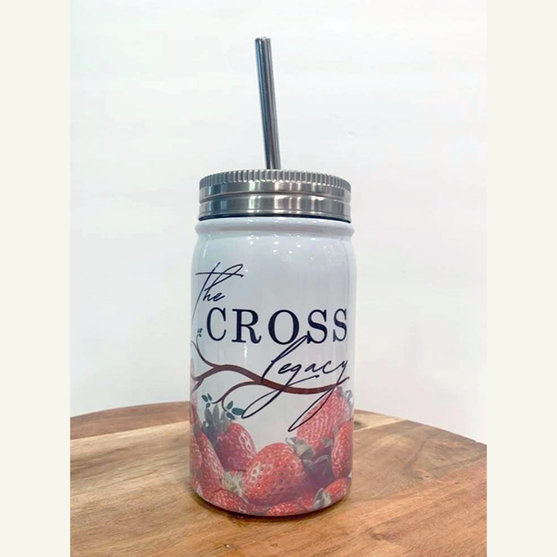 the-cross-legacy-stainless-steel-tumbler-sitting-on-a-wooden-table-with-white-background