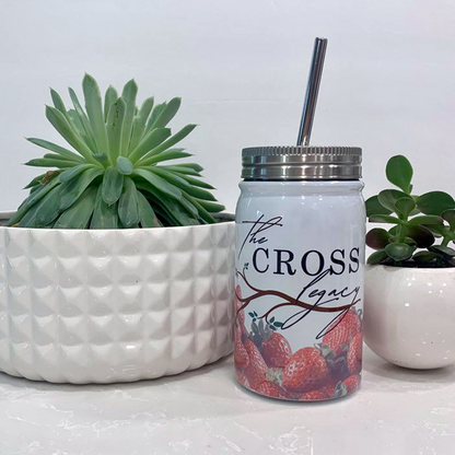 the-cross-legacy-stainless-steel-tumbler-sitting-on-a-white-counter-top-with-two-succulents-and-a-white-background